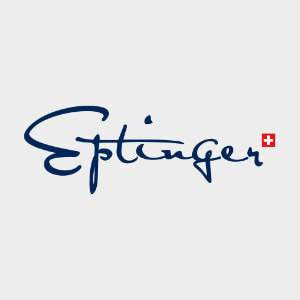 L'image montre le logo d'Eptinger avec le mot "Eptinger" écrit en lettres bleues stylisées. À la fin du mot se trouve un petit carré rouge avec une croix blanche, qui rappelle le drapeau suisse. Le fond gris clair indique subtilement l'engagement de la marque en faveur du développement durable et des pratiques respectueuses de l'environnement.